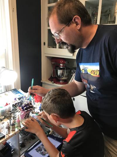 Ken Spencer and son painting miniatures